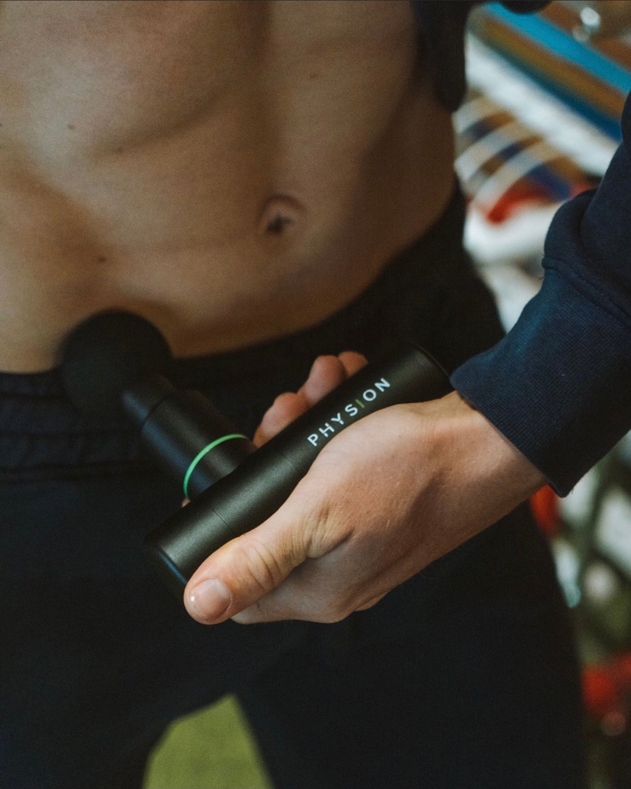 Una mini pistola de masaje Physion