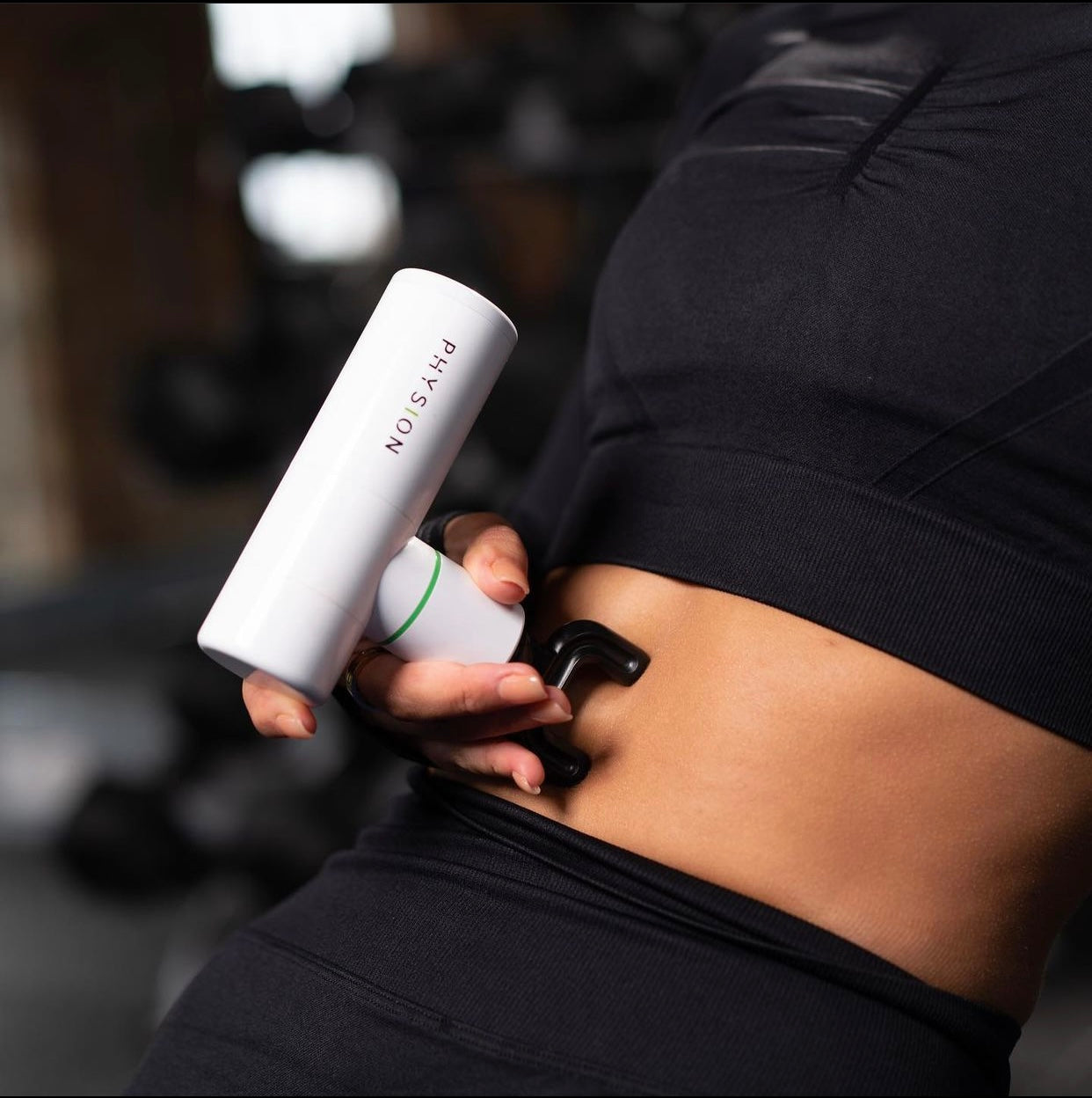 Una mini pistola de masaje Physion