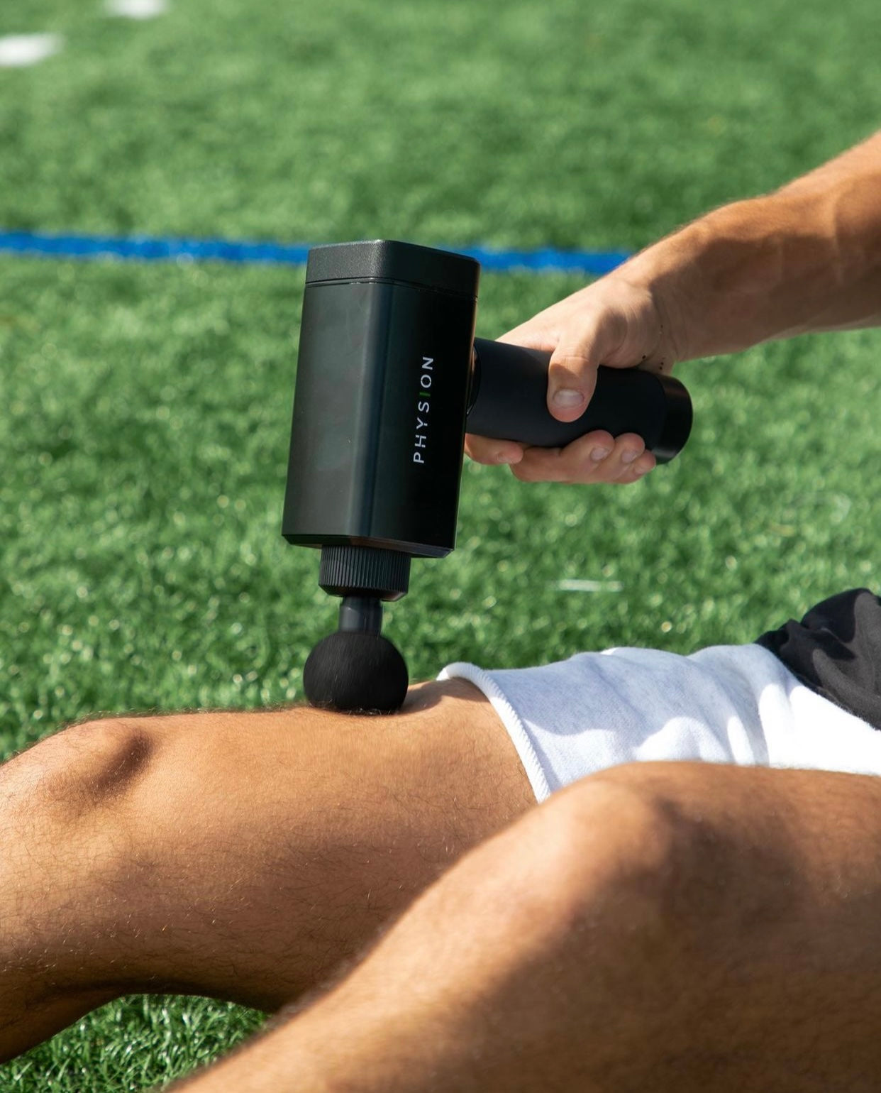 Una pistola de masaje Physion PRO