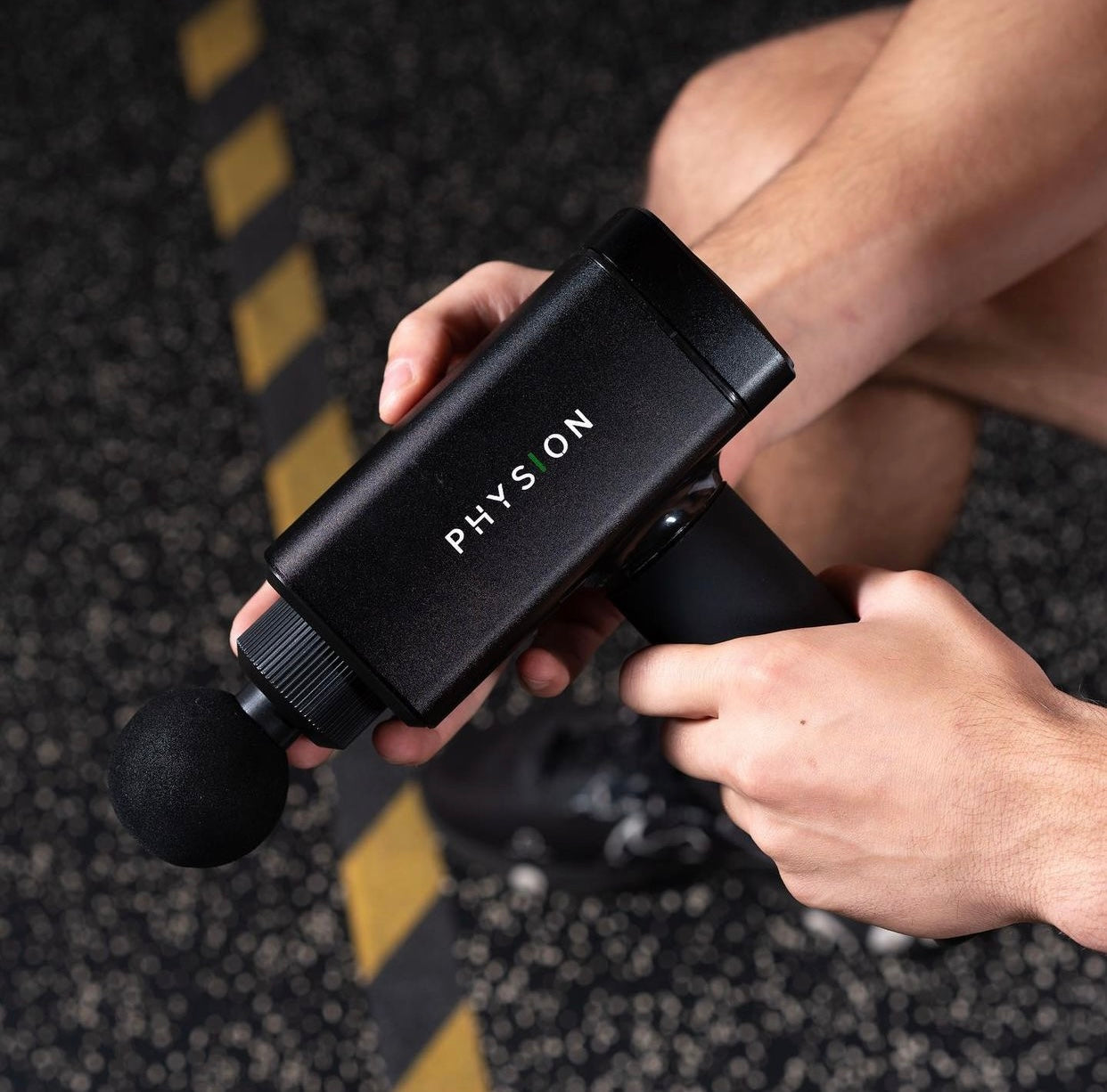 Una pistola de masaje Physion PRO